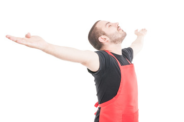 Attractive employee standing with arms outstretched
