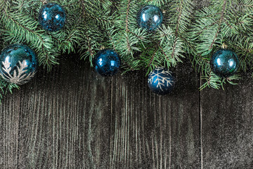 Christmas background with decorations on wooden board. Soft focus.