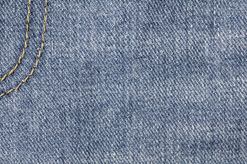 Naklejka premium Denim jeans texture or denim jeans background with seam. Old grunge vintage denim jeans. Stitched texture denim jeans background of jeans fashion design.