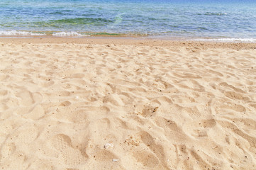 Sandy beach in foreground with sea in background