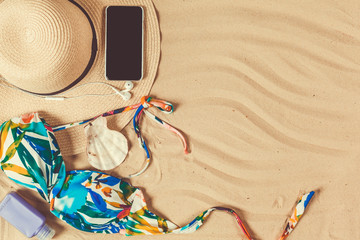 Holiday accessories on sand beach