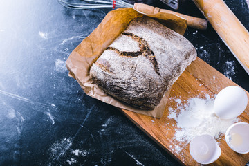 Ingredients and utensil for baking on the black board, top view