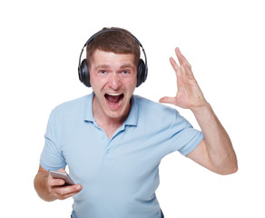 Fototapeta premium Happy young man with headphones sing and enjoy music