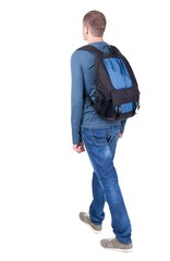 Naklejka premium back view of walking man with backpack. brunette guy in motion. backside view of person. Rear view people collection. Isolated over white background. 
