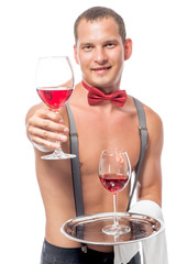 bartender, with a naked torso gives a glass of red wine