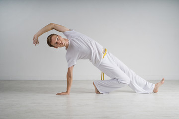 Naklejka premium Man practicing Capoeira , brazilian martial Art.