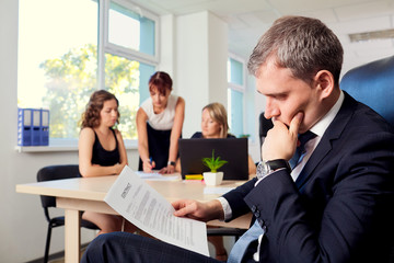 The concept of making business solution. Serious businessman rea