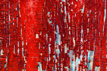 background texture of wooden barn planks with remnants of old paint red