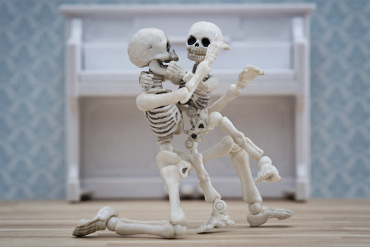 Skeleton hugging his child