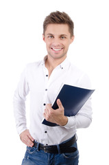 Happy young teacher with a notebook