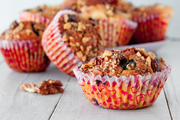 Homemade Nut Muffins cupcake on a wooden table, soft focus