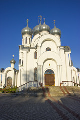 Fototapeta na wymiar Orthodox Church with domes against the blue sky