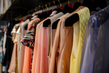Fototapeta na wymiar Clothes on racks in a fashion boutique