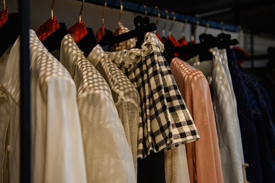 Clothes on racks in a fashion boutique