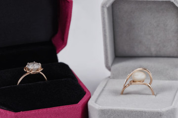 Gold rings with pearls and precious stones a gift box