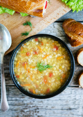 Lentil soup and beans on wooden background