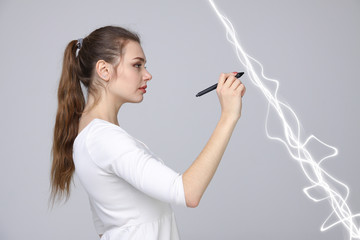 Woman making magic effect - flash lightning. The concept of electricity, high energy.