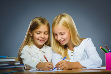 school concept. Closeup portrait successful happy girls drawing pencil