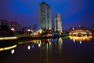 Fototapeta na wymiar Rivers with city modern architecture background Night