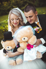 In the hands of the bride and groom plush toys. Wedding toys