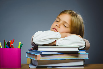 school concept. Closeup portrait girl asleep on pile of books