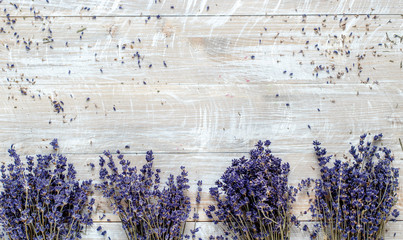 bouquets of lavender on a wooden table top view