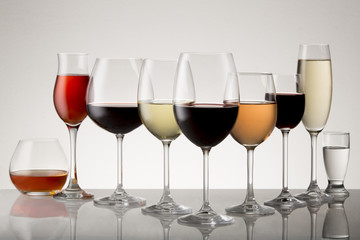 Collection of stemware with drinks.