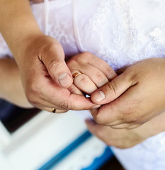 hands with wedding rings