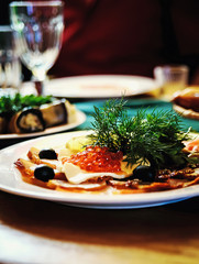 snack red caviar dill on a plate
