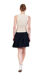 back view of walking  woman in dress. beautiful blonde girl in motion.  backside view of person.  Rear view people collection. Isolated over white background.