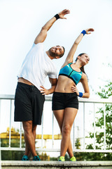 Happy Couple Exercising Outdoors