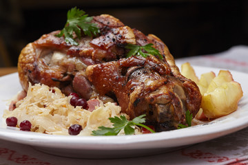fried pork knuckle with potatoes and cabbage
