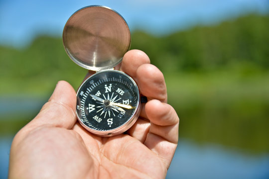 Magnetic compass in hand traveler.