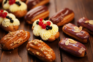 Eclairs on wooden table