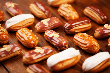 Eclairs on wooden table