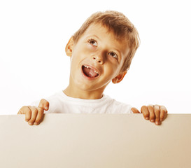 little cute boy holding empty shit to copyspace isolated close up gesturing smiling