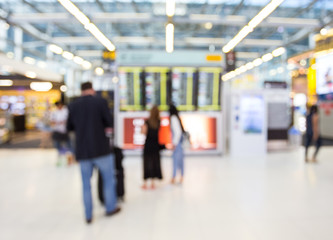 passenger look at the boarding time in airport with blur motion