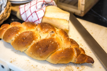 Loaf of Bread on Block with Knife