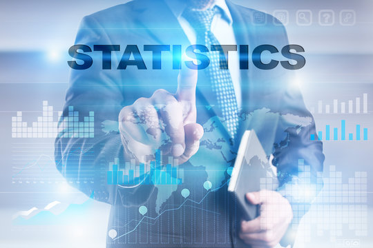 Businessman is pressing button on touch screen interface and selecting "Statistics".