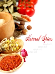 Foto op Canvas Verschillende specerijen en kruiden in houten lepels geïsoleerd op wit © Africa Studio