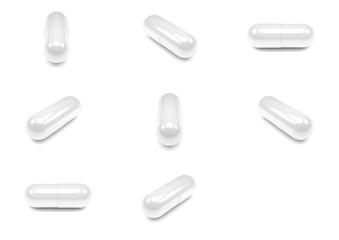 White pills capsules isolated on white background.