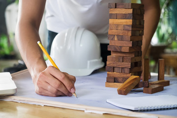 Close up man working of Architect sketching a construction proje