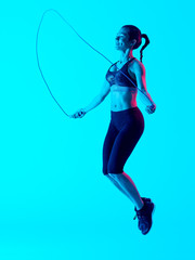 woman jumping rope  fitness exercices isolated