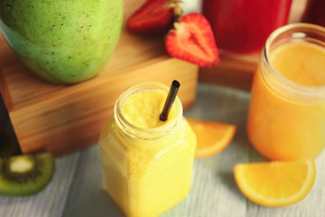Refreshing fruit smoothie on table