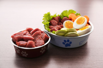 Healthy dog food on wooden background