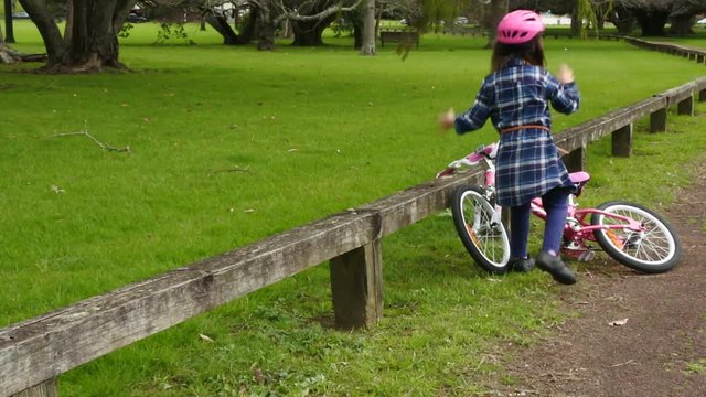 One sad little girl (age 6) do not know how to ride a bike. Children and childhood lifestyle concept. copy space