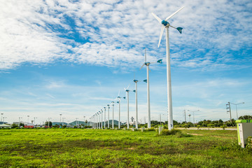 Fototapeta na wymiar Wind turbine with sky cloud sun daylight