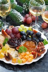 appetizers to the holiday - cheeses, fruits and jams, vertical