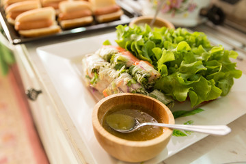 Fresh Vegetable Rice Wraps in dish with oils dip ready for sure (selective focus)