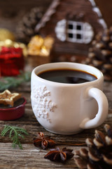 Cup of coffee, pine cones and Christmas-tree decorations